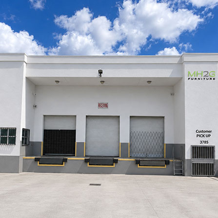 MH2G furniture warehouse in Miami Gardens with parking lot