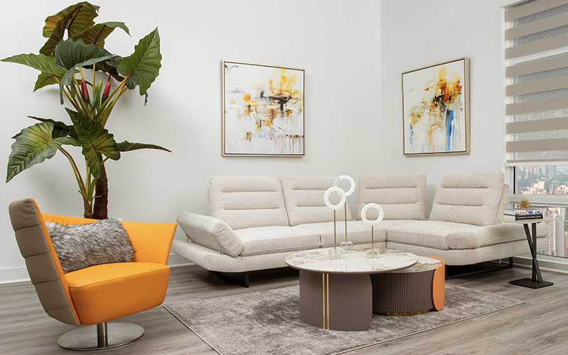 Modern Home Living Room Furniture. Elegant Beige Fabric Sectional Sofa, Vibrant Orange Accent Chair, and Chic Marble Top Coffee Table.