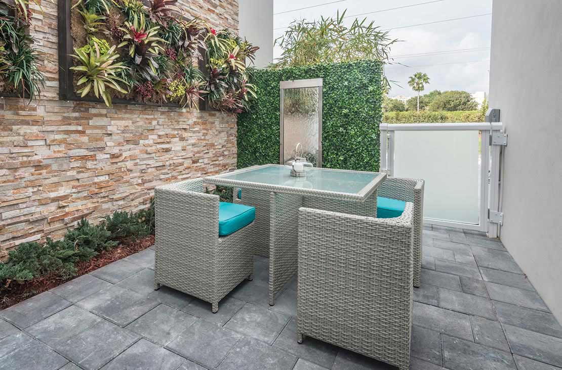Interior Design by MH2G Furniture - Modern Outdooor Dining Area at Landmark Modern Home A: 2 Story